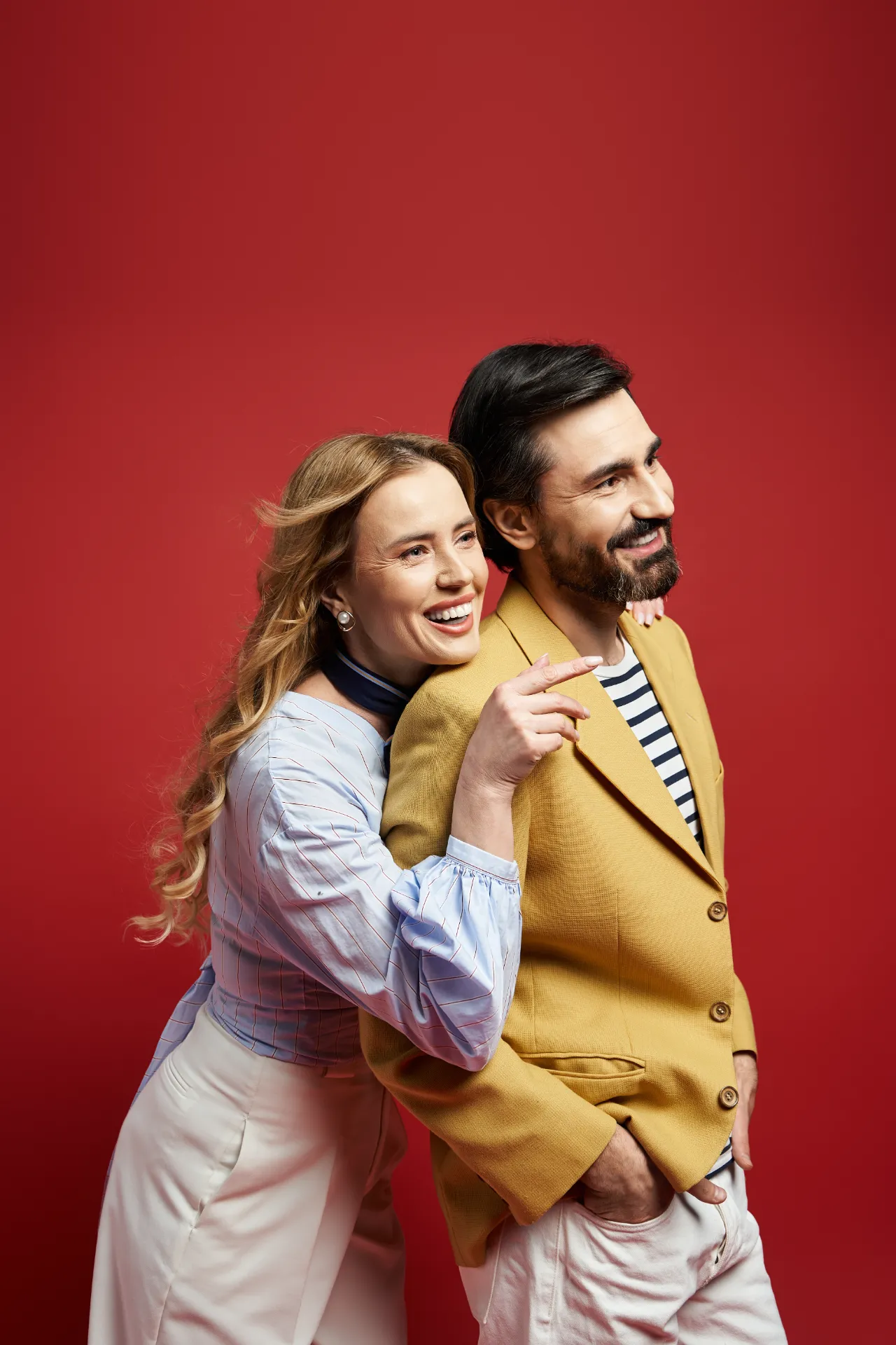 smiling woman and man in stylish clothes utc
